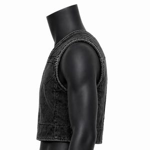 May include: A dark gray denim vest with a classic design. The vest features a V-neck, a button-up front, and a cropped length. The vest is displayed on a black mannequin.