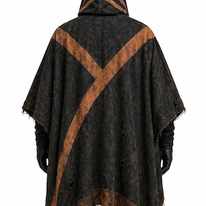 May include: Black hooded poncho with distressed details and a rust-colored cross design. The poncho features a pointed hood and tattered edges, offering a unique, edgy aesthetic. This garment is suitable for cosplay or alternative fashion.