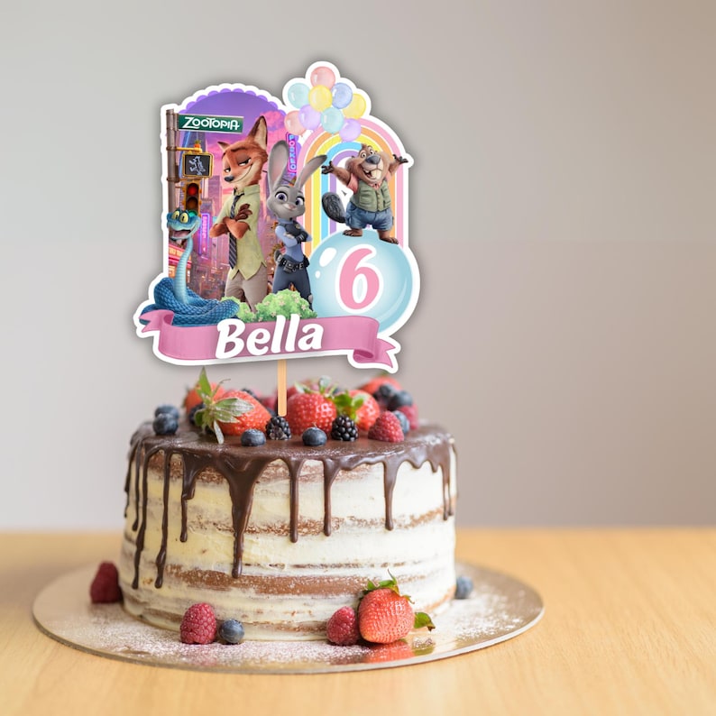 May include: A Zootopia themed cake topper featuring characters Nick Wilde, Judy Hopps, and a beaver, with a rainbow, balloons, the number 6, and the name Bella printed on a pink banner, displayed on a round cake with chocolate ganache and berries.