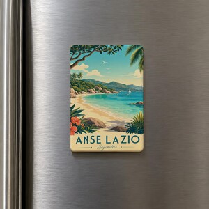 May include: A rectangular magnet featuring a scenic beach landscape with the text "ANSE LAZIO Seychelles". The image depicts a sandy beach, turquoise water, palm trees, and a sailboat under a blue sky with clouds. Red flowers and green plants frame the bottom.
