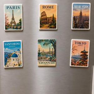 a collection of six vintage-style magnets on a refrigerator, each depicting a different city from around the world.