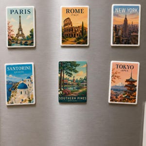 a collection of six vintage-style magnets on a refrigerator, each depicting a different city from around the world.