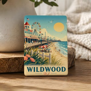 A coaster featuring an illustration of a beach and amusement park with a ferris wheel, palm trees, and people enjoying the beach.