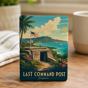 May include: A rectangular sign featuring a colorful illustration of the Last Command Post in Saipan. The image depicts a concrete bunker, a palm tree, a waving American flag, a coastal landscape with a sailboat, and the text Last Command Post.