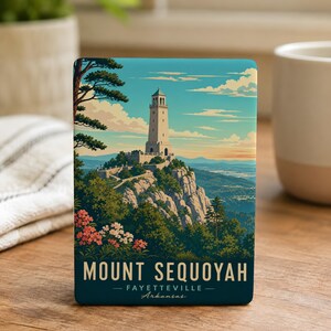 May include: A rectangular Mount Sequoyah art print featuring a scenic view of a tall white tower on a mountain, surrounded by green trees and colorful flowers. The print has the text "MOUNT SEQUOYAH - FAYETTEVILLE - Arkansas" in a dark teal color.