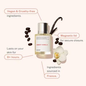 May include: A perfume bottle labeled "AMBERY VANILLA" with a silver cap, surrounded by coffee beans, a vanilla bean, and a white orchid. The text indicates vegan, cruelty-free ingredients, a magnetic lid, and that it lasts on the skin for 8+ hours. Ingredients sourced in France.