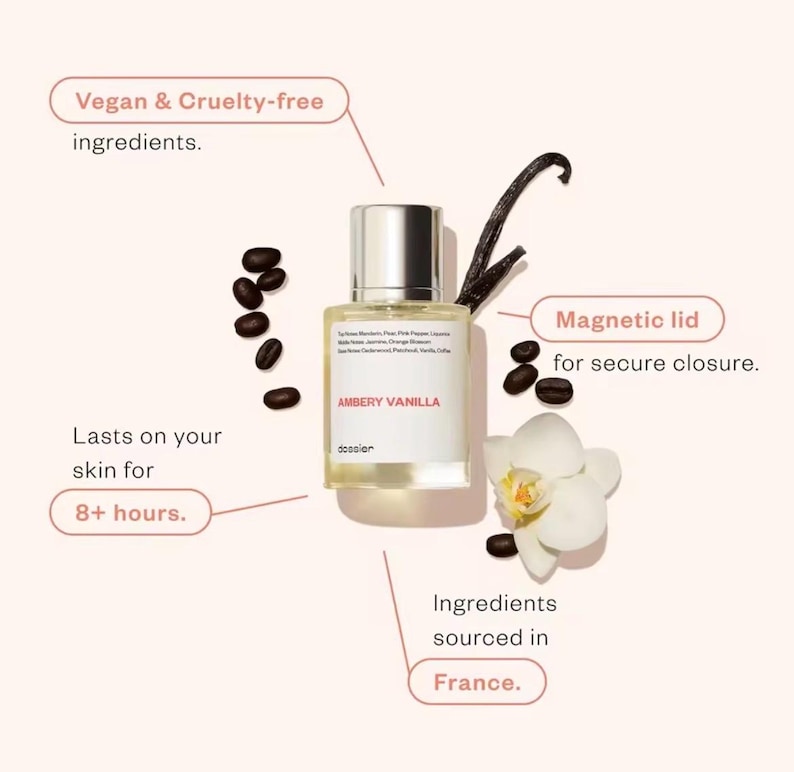 May include: A perfume bottle labeled "AMBERY VANILLA" with a silver cap, surrounded by coffee beans, a vanilla bean, and a white orchid. The text indicates vegan, cruelty-free ingredients, a magnetic lid, and that it lasts on the skin for 8+ hours. Ingredients sourced in France.