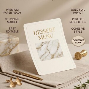 May include: A cream-colored dessert menu card with gold foil text and a marble design. The card is on a beige linen napkin with a gold pen and floral accents. Text on the card reads "DESSERT MENU". Additional text includes "UNCOMPROMISING QUALITY: YOUR DESIGNS, REFINED".
