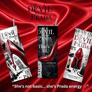 May include: Three tumblers with straws featuring "The Devil Wears Prada II" designs. Each tumbler showcases a red high heel, with text and graphics. The background is a red satin fabric. The phrase "She's not basic... she's Prada energy" is at the bottom.