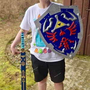 May include: A blue and silver shield with red and yellow accents, and a matching blue and gold sword. The shield has a silver border and a blue center with a yellow triangle and red designs. The sword has a blue blade and a gold hilt.