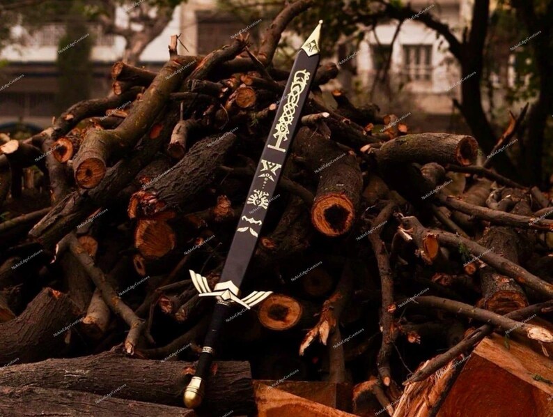 May include: A black sword with gold accents, featuring intricate designs on the blade and hilt. The sword is displayed against a backdrop of stacked logs, showcasing its detailed craftsmanship and fantasy theme.