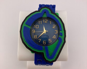Reloj infantil Gorilla Tag Inspired AA Badge de 43 mm, color azul verdoso, con impresión 3D y correa ajustable de 7,5 pulgadas.