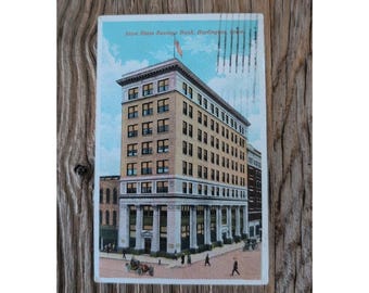 Postal antigua del Iowa State Savings Bank de Burlington, con sello y escritura de la década de 1900.