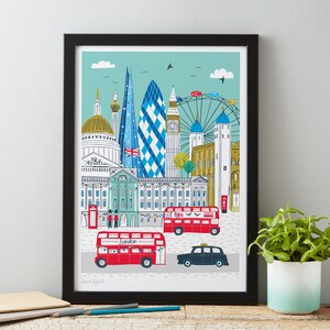 May include: A colorful illustration of London landmarks, including Big Ben, the London Eye, and the Shard. The illustration features red double-decker buses, a black taxi, and the text "London".