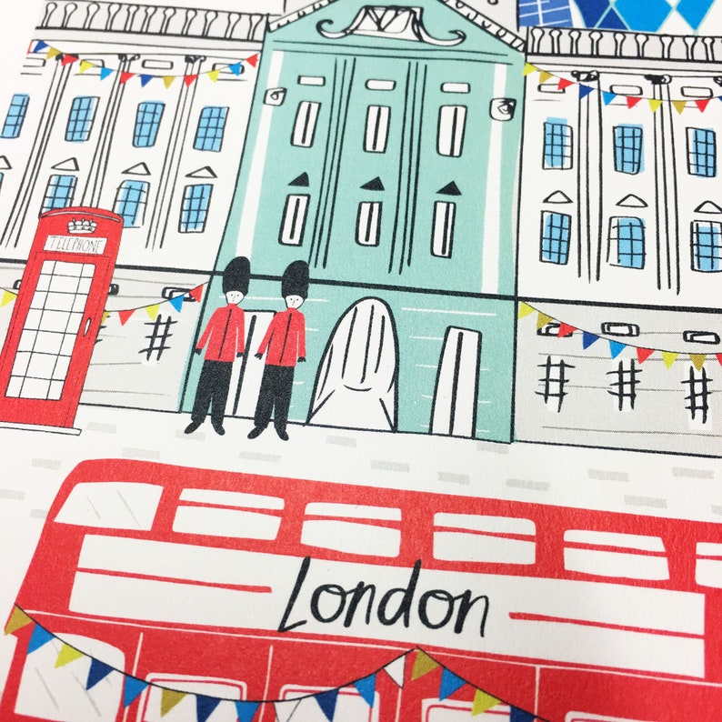 May include: A red double-decker bus with the word "London" printed on the side. The bus is decorated with colorful flags and is parked in front of a building with a red telephone booth.