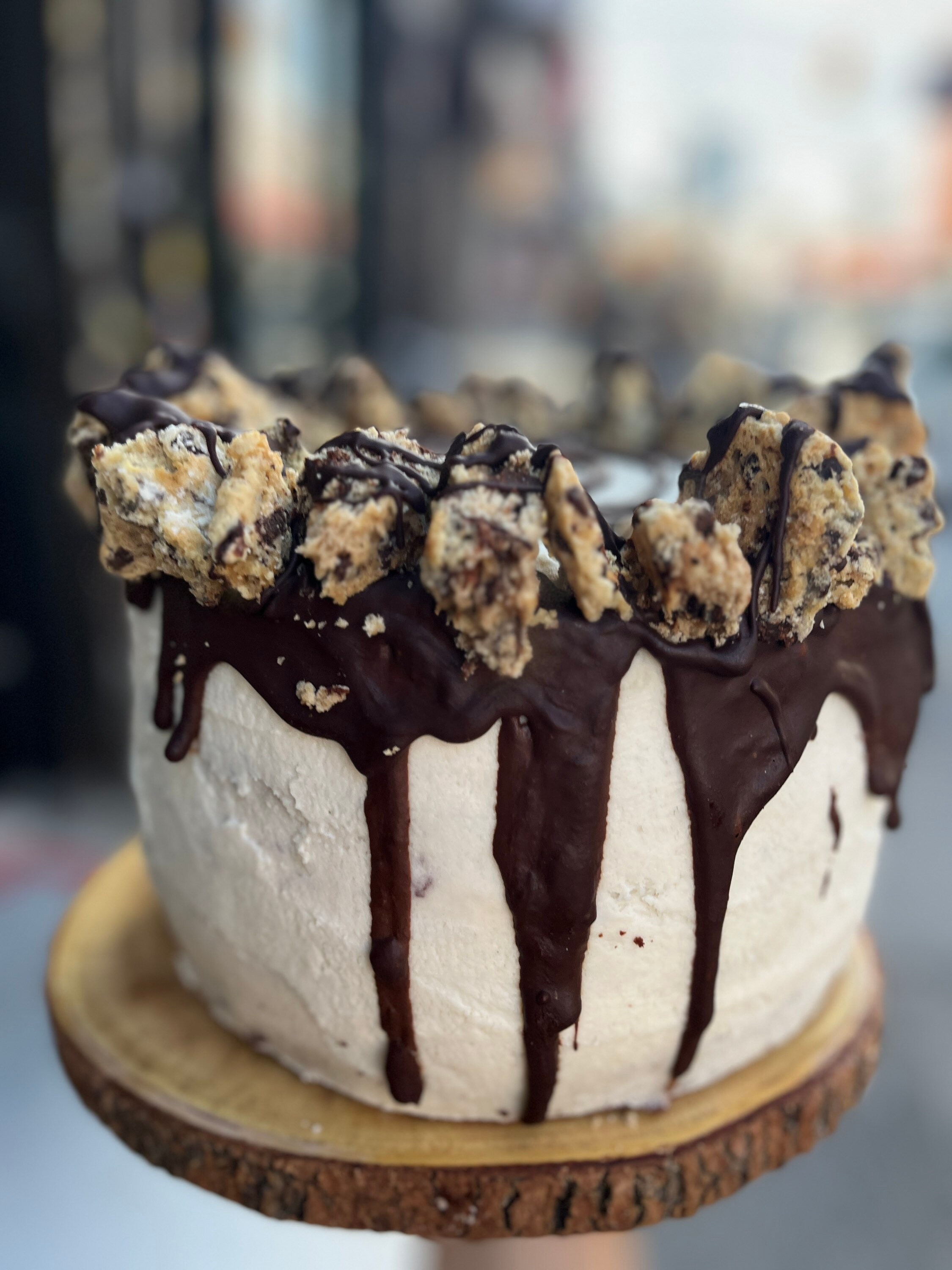 Vegan chocolate vanilla buttercream cherry filling dark chocolate cake with chocolate chip