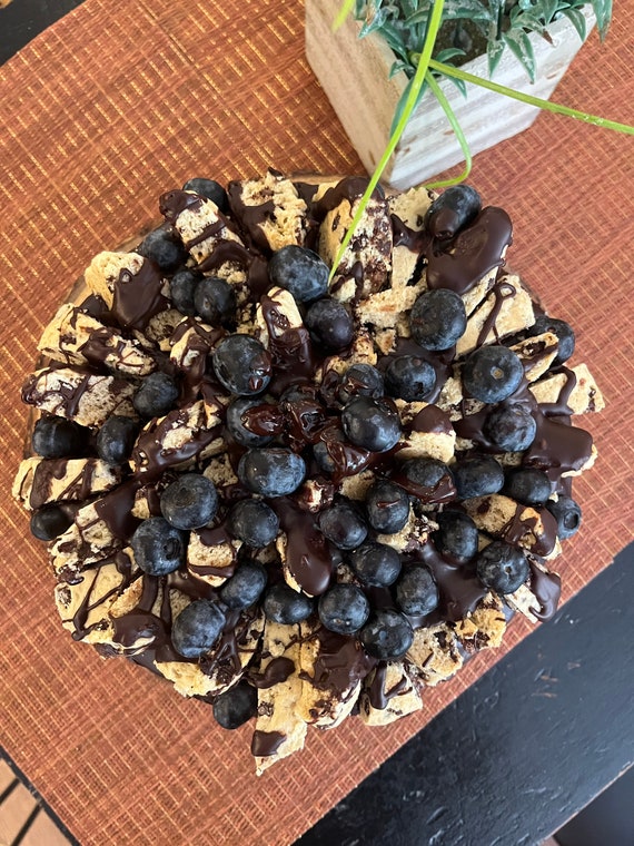 Vegan special edition vanilla blueberry chocolate cake with chocolate chip cookies and fresh blueberries on the top    8”!
