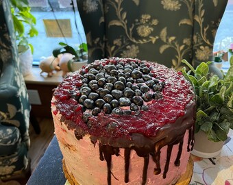Vegan  double chocolate vanilla cream blueberry  cake  with fresh blueberries on the top 8”!