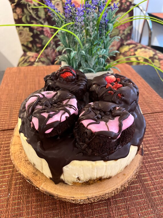 Vegan Gluten Free Vanilla chocolate cheesecake  with vegan gluten free donuts  on the top 8"