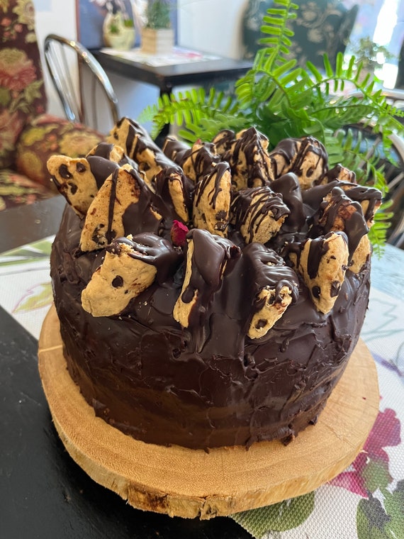 Vegan chocolate vanilla buttercream blackberry cake with chocolate chip cookies on the top  8”!