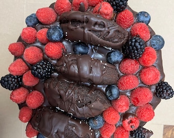 Vegan  chocolate vanilla cream raspberry cake  with donuts and fresh berries  on the top 8”!