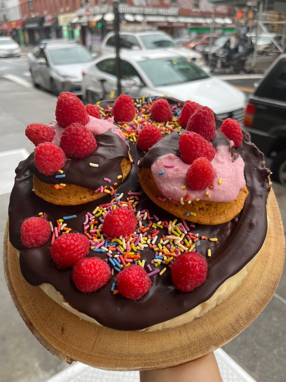 Vegan Gluten Free Vanilla chocolate cheesecake  with vegan gluten free donuts and raspberries   on the top 8"