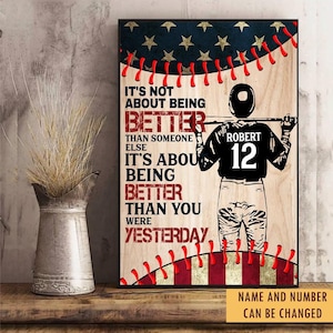 May include: A rectangular wall art print featuring a baseball player in a jersey with the name Robert and number 12, holding a bat. The background has a wood grain texture, American flag motifs, and red baseball stitching. Text reads: It's not about being better than someone else, it's about being better than you were yesterday.