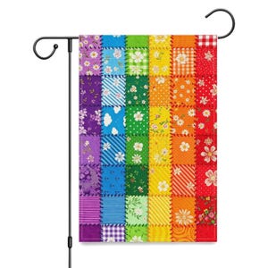 May include: A rectangular garden flag featuring a vibrant patchwork design arranged in vertical rainbow-colored columns. Each section displays various patterns including floral prints, gingham, stripes, and polka dots in shades of purple, blue, green, yellow, orange, and red.