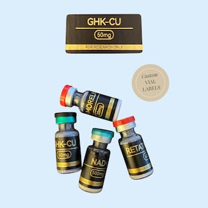 May include: Four glass vials with black labels and colored caps, labeled GHK-CU 50mg, AMORELIN 20mg, NAD+ 500mg, and RETAT 40mg, all marked FOR RESEARCH ONLY. A rectangular black sign reads GHK-CU 50mg FOR RESEARCH ONLY, and a round beige sticker says Custom VIAL LABELS.