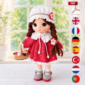 May include: A crocheted doll with brown hair in braids, wearing a white bonnet with a pink flower, a red dress with white lace trim, and a white collar. The doll holds a small tan basket filled with colorful flowers and wears gray shoes.