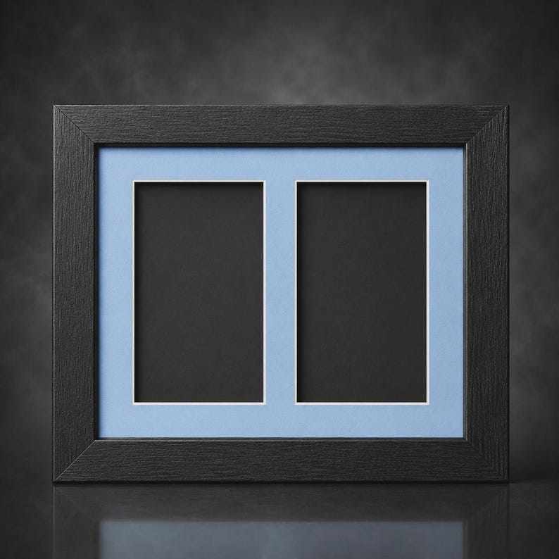 May include: A rectangular black picture frame with two openings. The frame has a light blue matting and white borders around the openings. The frame is made of wood and has a textured surface.