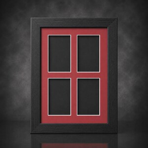 May include: A black multi-aperture picture frame with a red mat and white borders. The frame holds four rectangular openings for photos. The frame is made of wood and has a matte finish. The overall design is simple and elegant.