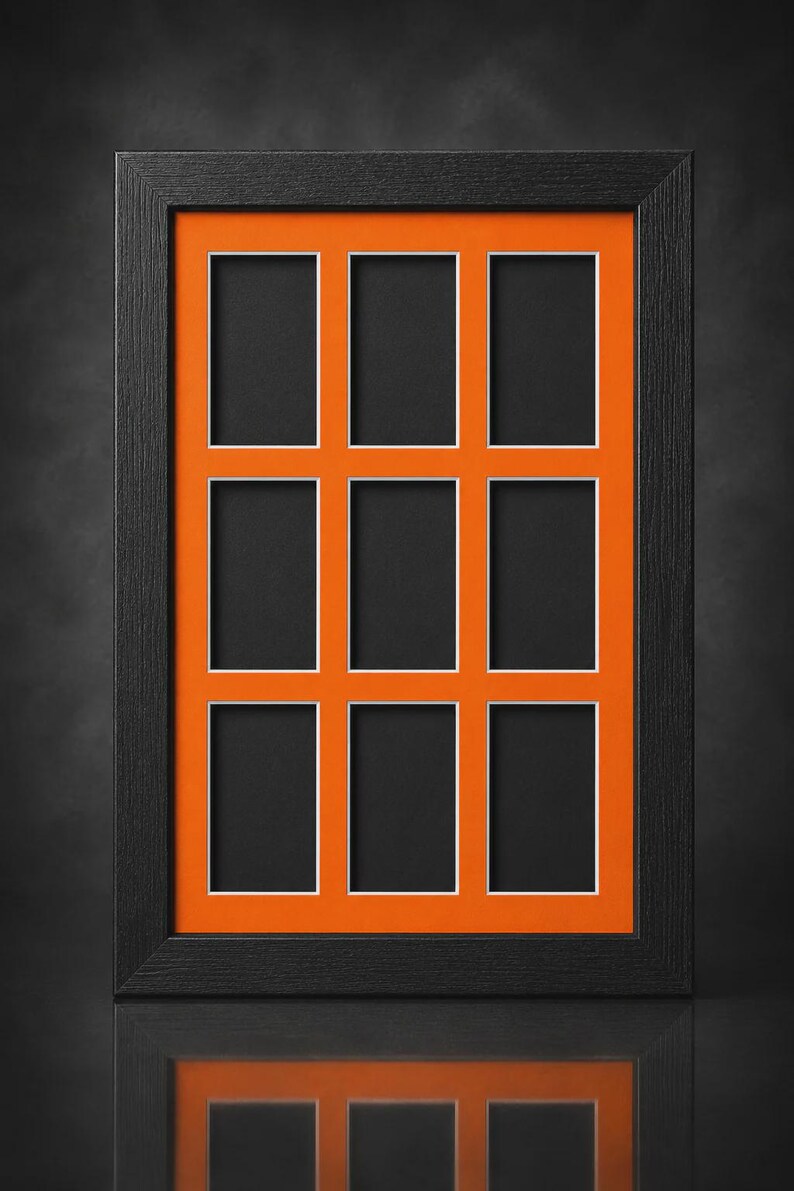 May include: A black picture frame with nine openings, each with a white border, set against an orange background. The frame is rectangular and has a dark wood grain texture. The overall design is modern and suitable for displaying multiple photos.
