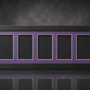 May include: A rectangular black picture frame with five openings. Each opening has a white border and a black interior, set against a purple background. The frame is displayed on a reflective surface.