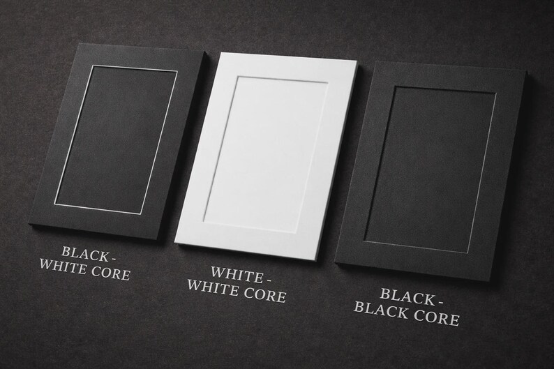 May include: Three rectangular picture frames in black and white, with the text "BLACK - WHITE CORE", "WHITE - WHITE CORE", and "BLACK - BLACK CORE". The frames are arranged on a dark gray surface.