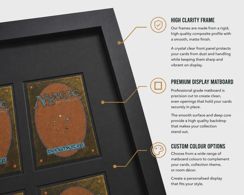 May include: Black framed display case with multiple openings for collectible cards. The case features a high-clarity frame, premium display matboard, and custom color options. The text on the cards reads "MAGIC" and "DECKMASTER".
