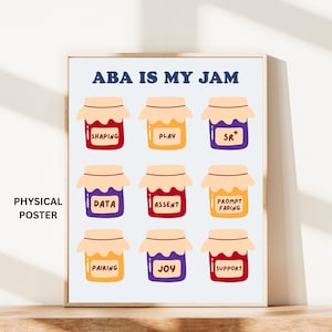 May include: A framed poster with the text "ABA IS MY JAM" above nine jam jars, each labeled with ABA therapy terms like "Shaping" and "Data." The poster is displayed on a wooden surface.
