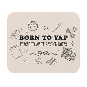 May include: Beige mousepad with black line art of a beach ball, building blocks, a pen, a fidget spinner, and other doodles. The text "BORN TO YAP FORCED TO WRITE SESSION NOTES" is in the center.