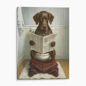 May include: A brown dog sitting on a white toilet, reading a newspaper. The dog is wearing red and blue plaid pants pulled down around its ankles. The scene is set in a bathroom with light blue wainscoting and a white towel hanging on the wall.
