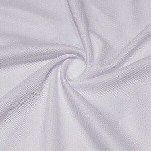 May include: A solid white fabric with a fine, uniform mesh texture. The material is gathered in the center, creating soft, flowing folds and ripples that radiate outward, highlighting the consistent weave and bright, clean white color throughout.