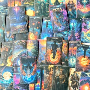 May include: A collection of tarot cards featuring vibrant, surreal illustrations of celestial bodies, landscapes, and figures. The cards are arranged in a dense, overlapping layout, displaying various titles such as Seven of Wands, The Chariot, The Fool, The Hierophant, and King of Wands.