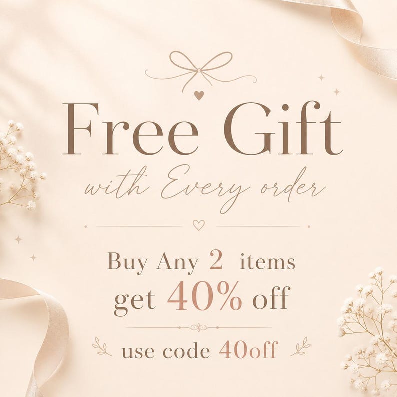 May include: A beige promotional graphic featuring the text Free Gift with Every order, followed by Buy Any 2 items get 40% off, and use code 40off. The design includes a small bow icon, heart symbols, and white floral accents on the sides.
