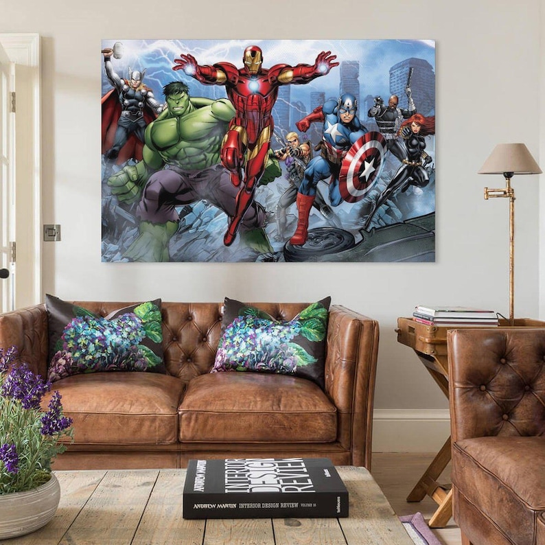 May include: A large canvas print featuring a group of Marvel superheroes, including Iron Man, Captain America, and the Hulk, against a cityscape backdrop. The artwork showcases vibrant colors and dynamic action poses, suitable for a fan's home decor.