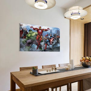 May include: A rectangular canvas print featuring a group of comic book superheroes. The characters include Iron Man, Hulk, Thor, Captain America, and Black Widow. The artwork is set against a cityscape backdrop with a dynamic, action-oriented composition.