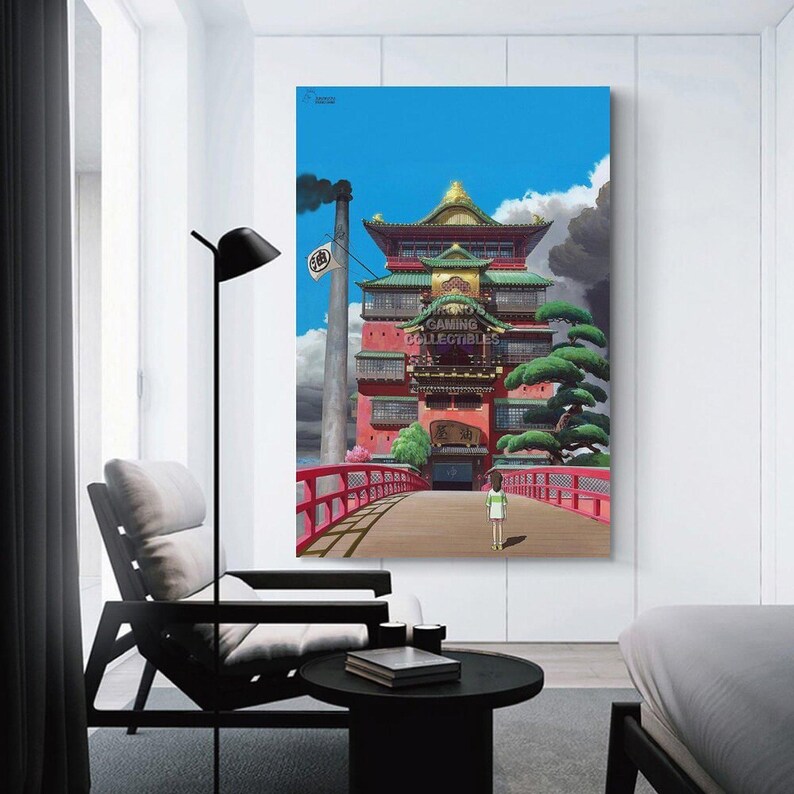 May include: A framed canvas print of a vibrant anime scene. The artwork depicts a large, multi-story building with red and green accents, a red bridge, and a person walking towards it. The sky is blue with clouds and a smokestack.