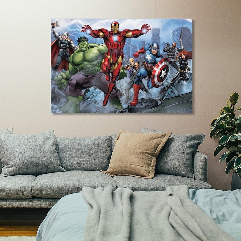May include: A canvas print featuring a group of superheroes, including Iron Man, Hulk, Captain America, and Thor. The artwork depicts the characters in action with a cityscape backdrop and lightning effects.