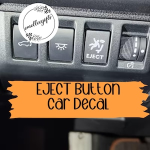 May include: A close-up of a car's dashboard with several buttons, including one labeled "EJECT." An orange banner below reads "EJECT Button Car Decal." A circular logo with text is in the upper left corner.