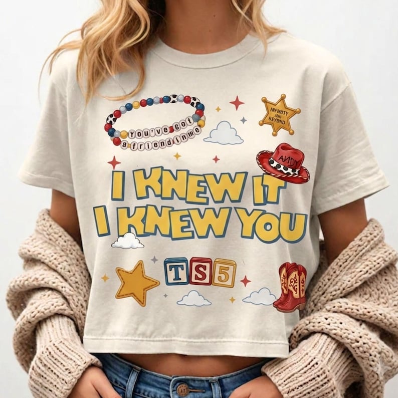 Retro Toy Story 5 inspired PNG design with I Knew It I Knew You text, western cowgirl boots, friendship bracelet, stars, clouds, and toy blocks.
Toy Story 5 birthday shirt design featuring yellow blue retro text, western cowgirl boots, bracelet beads, cowboy hat, badge, clouds, and stars.
I Knew It I Knew You western shirt graphic with Toy Story 5 style, red cowgirl boots, friendship bracelet, playful stars, and colorful toy blocks.