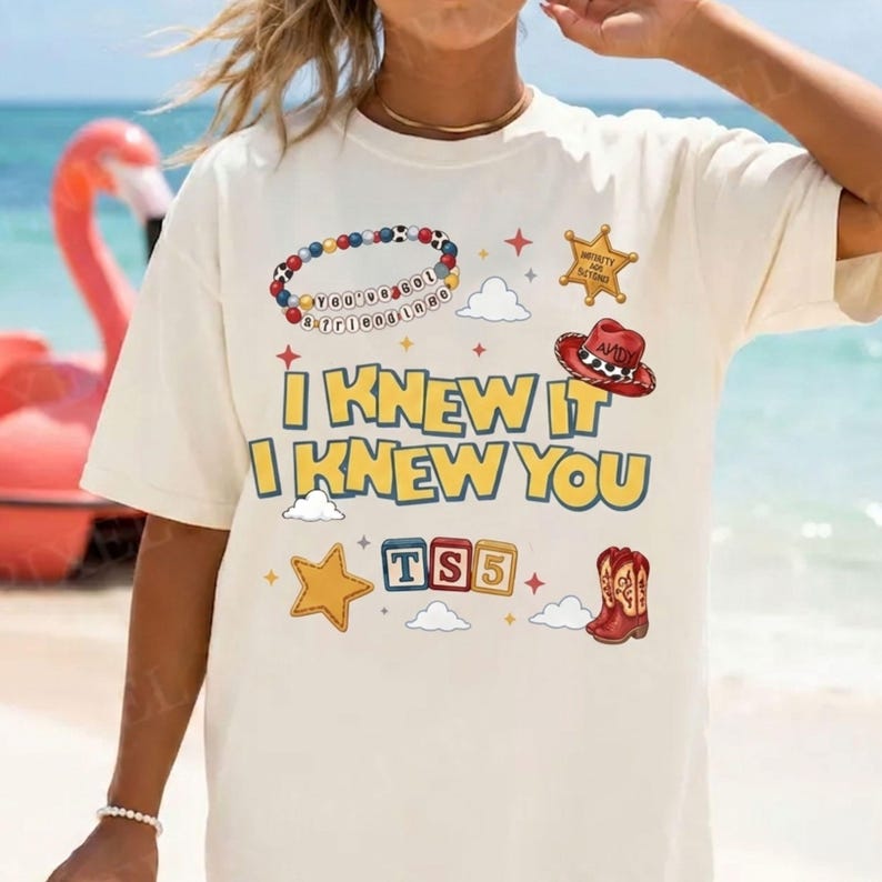 Cute western friendship bracelet shirt design with Toy Story 5 theme, yellow blue text, red cowgirl boots, cowboy hat, clouds, badge, and sparkle stars.
Toy Story 5 western birthday PNG design with bold retro lettering, I Knew It I Knew You text, friendship bracelet, red boots, toy blocks, and clouds.
Retro cowgirl birthday shirt graphic inspired by Toy Story 5 with playful text, western boots, bracelet beads, sheriff star, cowboy hat, clouds, and sparkles.