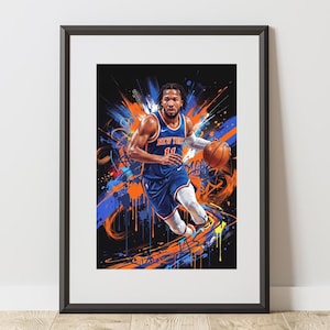 May include: A framed art print featuring a basketball player in a blue and orange New York jersey with the number 11, dribbling a basketball against a black background with vibrant blue and orange paint splatter and graffiti-style brush strokes.